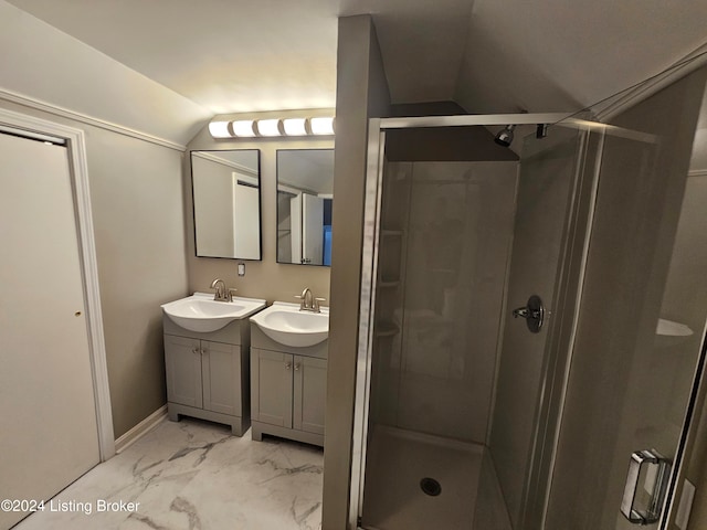 bathroom featuring vanity, vaulted ceiling, and an enclosed shower