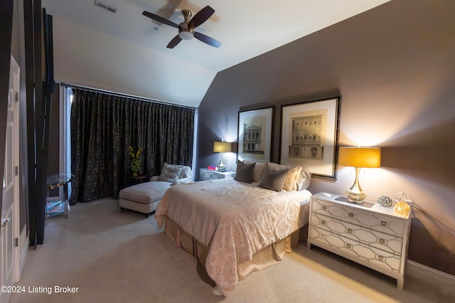 carpeted bedroom with ceiling fan and lofted ceiling