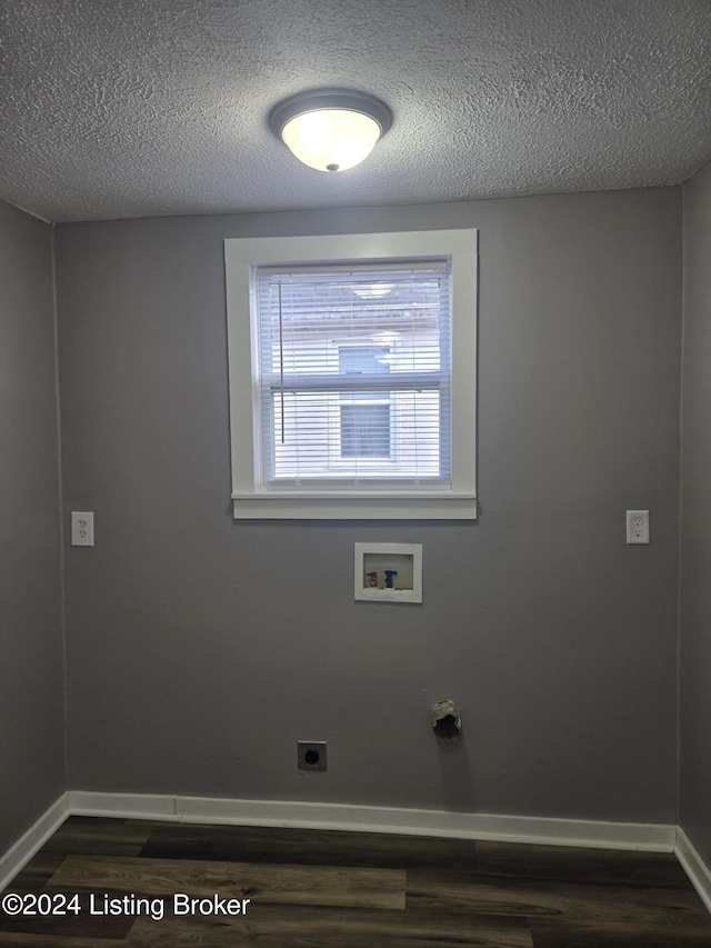 laundry room featuring washer hookup, dark hardwood / wood-style floors, hookup for an electric dryer, and a textured ceiling