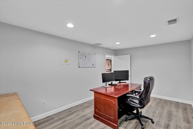 office with light hardwood / wood-style flooring