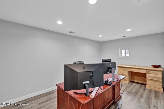 home office featuring light hardwood / wood-style floors