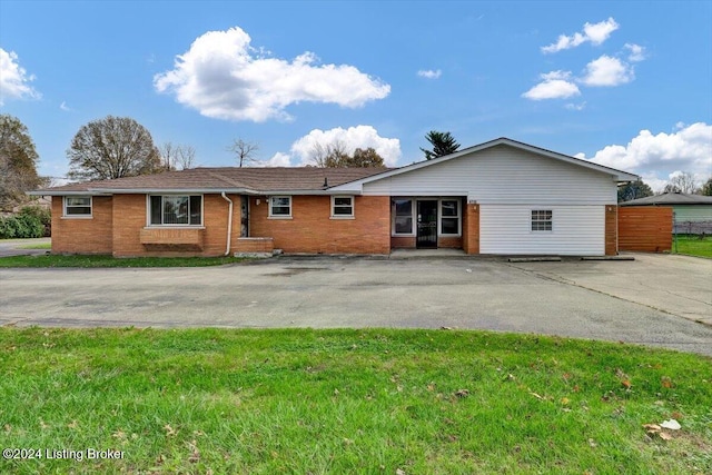 ranch-style house with a front lawn