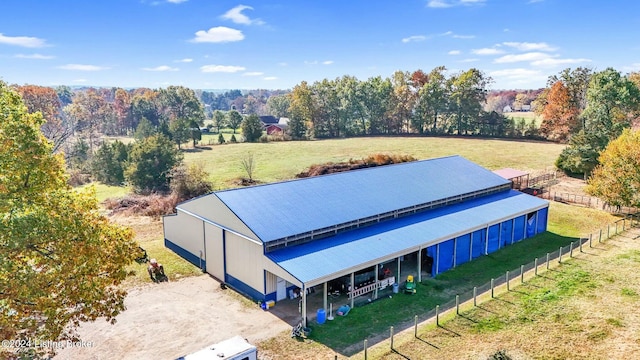 birds eye view of property with a rural view