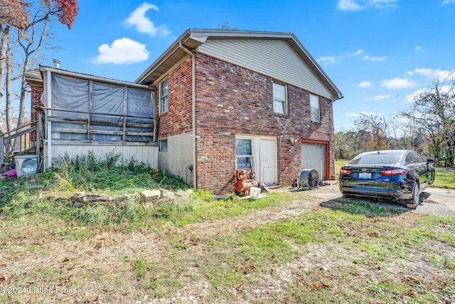 view of side of property featuring a garage