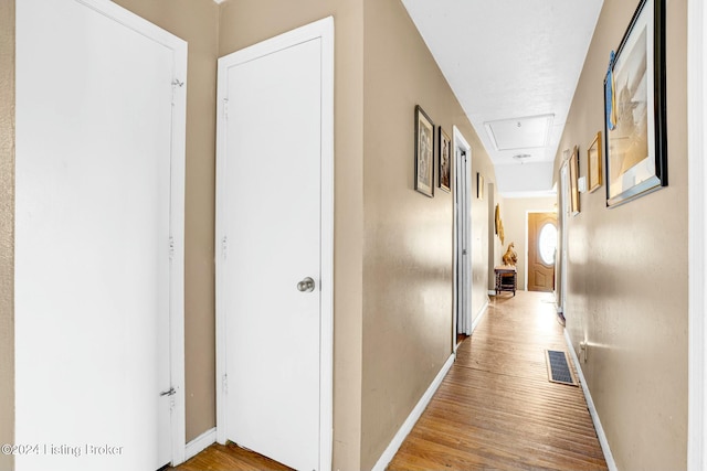 hall with light hardwood / wood-style flooring