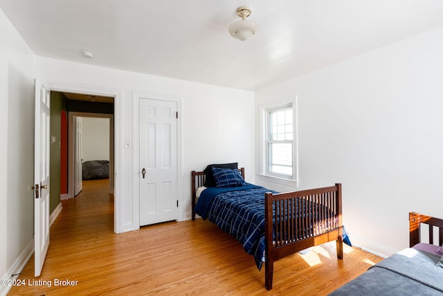 bedroom with light wood-type flooring