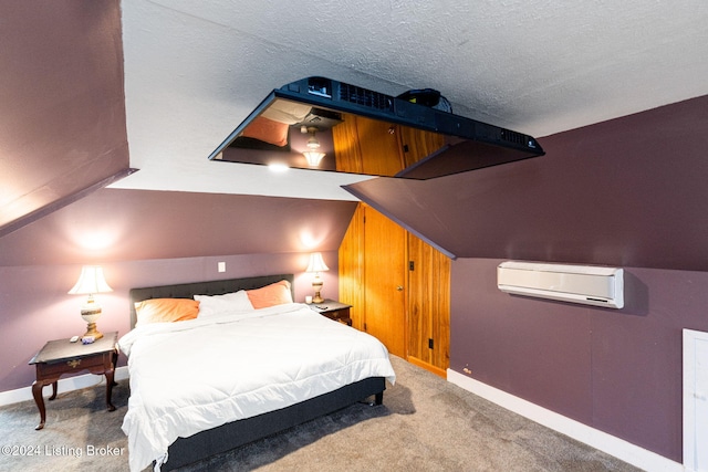 carpeted bedroom with a wall mounted air conditioner, lofted ceiling, and a textured ceiling