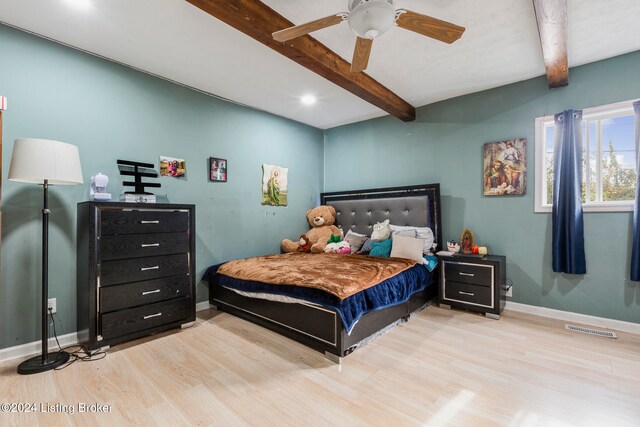 bedroom with beamed ceiling, light hardwood / wood-style floors, and ceiling fan