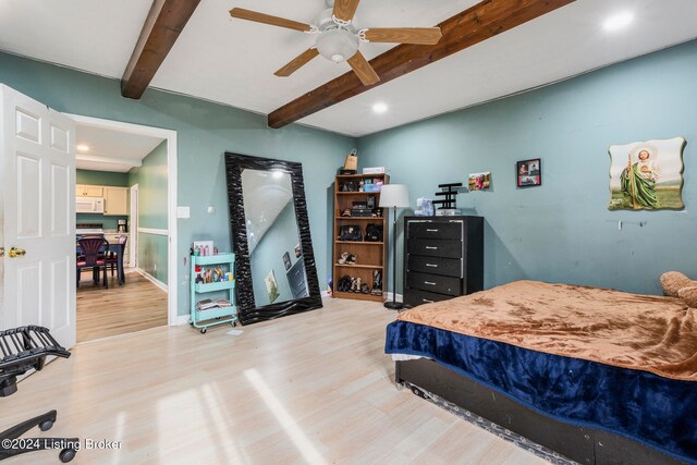 bedroom featuring beam ceiling, light hardwood / wood-style flooring, and ceiling fan