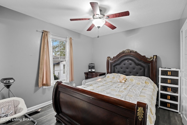 bedroom with hardwood / wood-style flooring, ceiling fan, and a textured ceiling