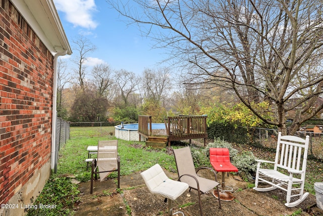 view of yard with a pool side deck