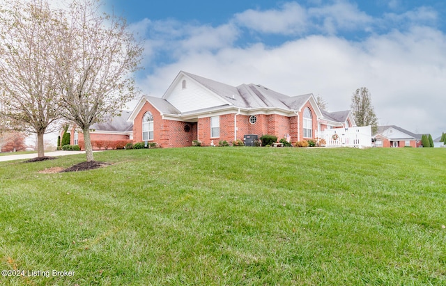 view of front of house with a front lawn