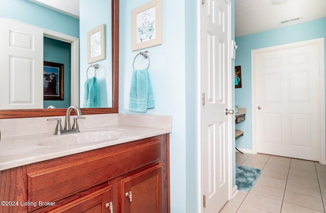 bathroom with tile patterned flooring and vanity