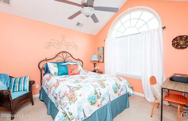 bedroom with ceiling fan, light carpet, and vaulted ceiling