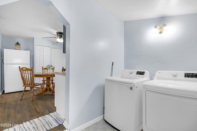 laundry room with ceiling fan, washer and dryer, and hardwood / wood-style flooring