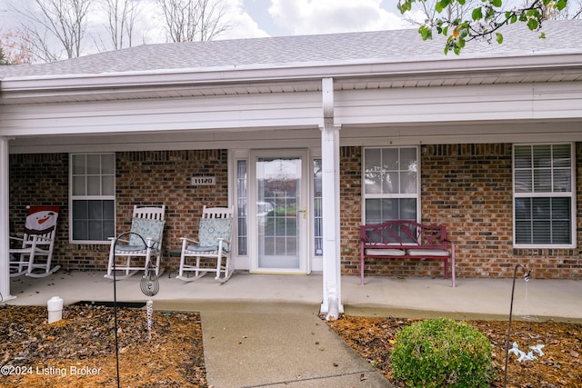 property entrance with covered porch