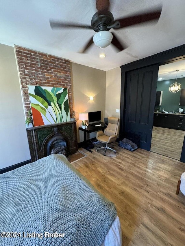 bedroom featuring hardwood / wood-style flooring and ceiling fan