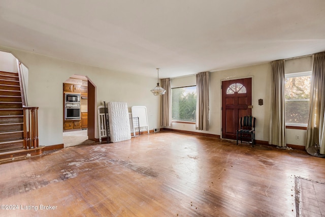 unfurnished living room with hardwood / wood-style flooring