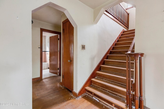 staircase featuring hardwood / wood-style floors