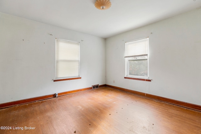 empty room featuring hardwood / wood-style flooring