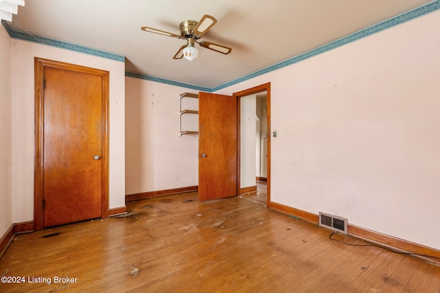 unfurnished bedroom with hardwood / wood-style flooring and ceiling fan