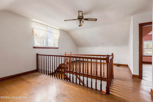 bonus room with ceiling fan, vaulted ceiling, and hardwood / wood-style flooring