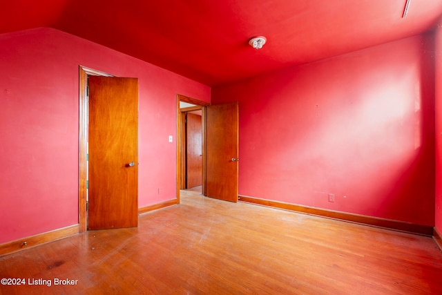 unfurnished bedroom featuring light wood-type flooring