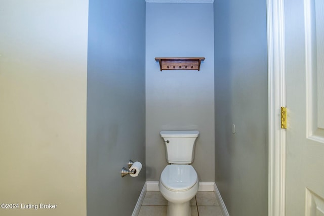 bathroom with tile patterned flooring and toilet