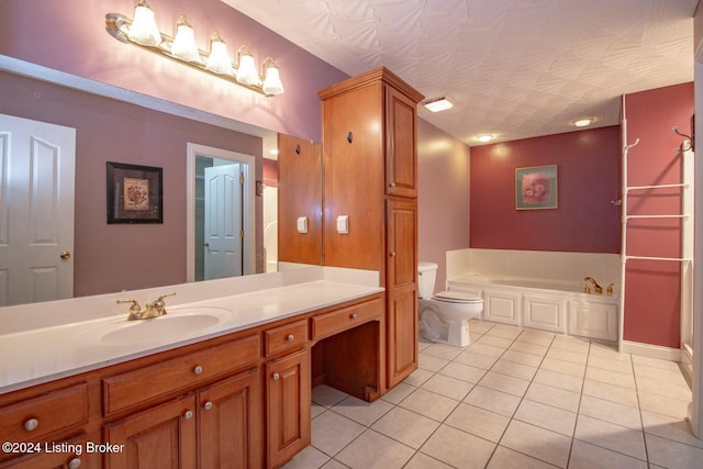 bathroom featuring toilet, a bathtub, vanity, and tile patterned flooring