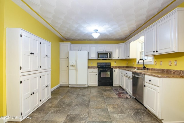 kitchen with sink, white cabinets, and stainless steel appliances