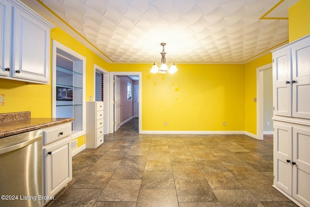 unfurnished dining area with an inviting chandelier