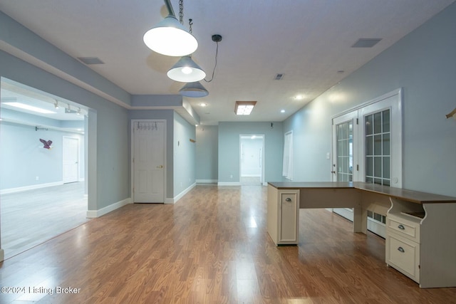 unfurnished office featuring light wood-type flooring