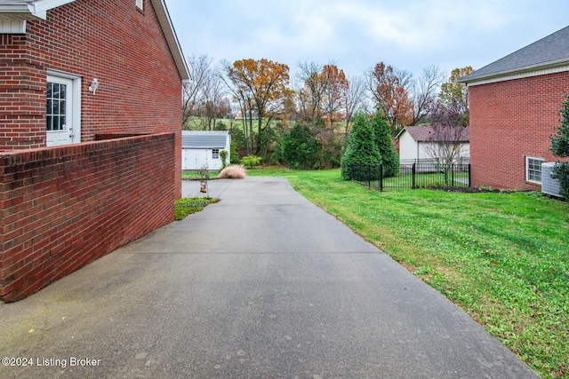 view of side of property with a lawn