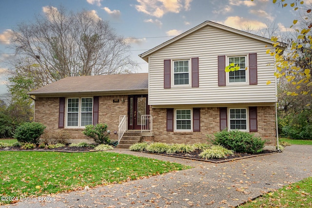 split level home with a front yard