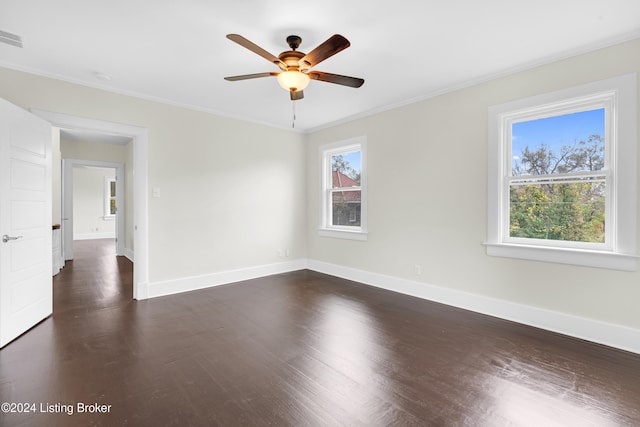 unfurnished room with ceiling fan, dark hardwood / wood-style flooring, and crown molding