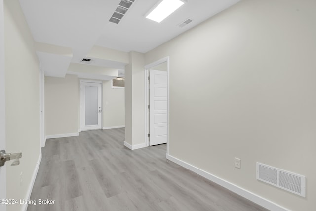 spare room featuring light hardwood / wood-style flooring