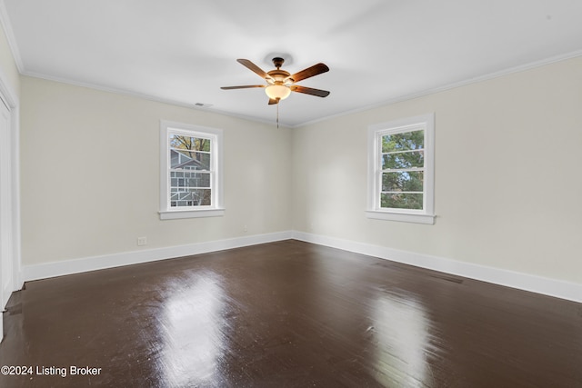 unfurnished room featuring hardwood / wood-style flooring, ceiling fan, and ornamental molding