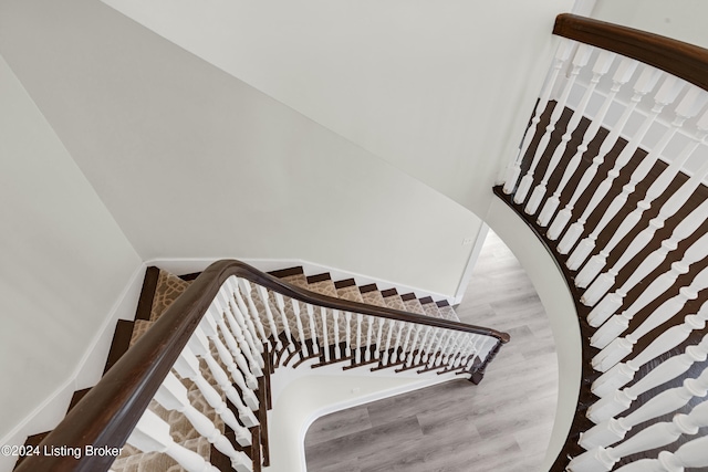 stairway featuring hardwood / wood-style flooring