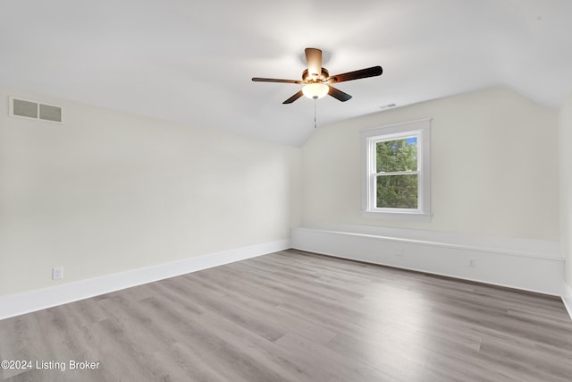 bonus room with ceiling fan, light hardwood / wood-style flooring, and vaulted ceiling