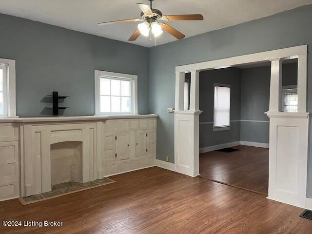 interior space featuring ceiling fan and dark hardwood / wood-style floors