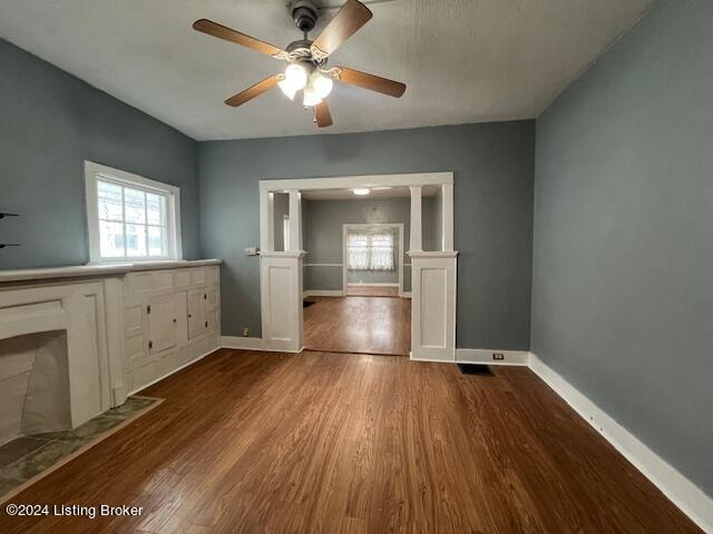 interior space with hardwood / wood-style floors, plenty of natural light, and ceiling fan