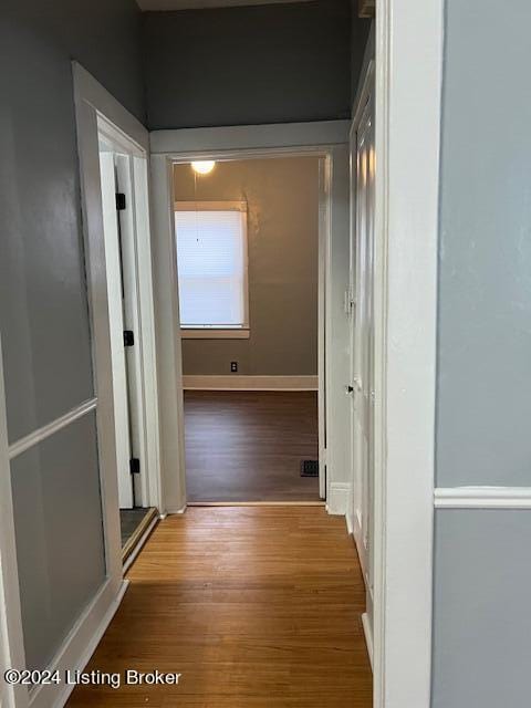 hall with light hardwood / wood-style floors