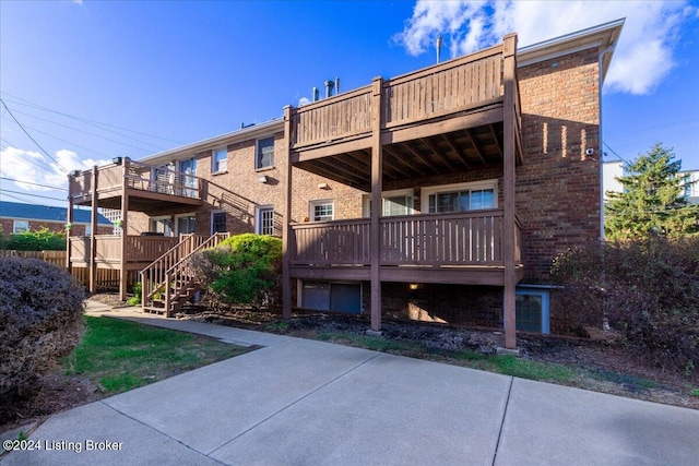 rear view of house featuring a deck