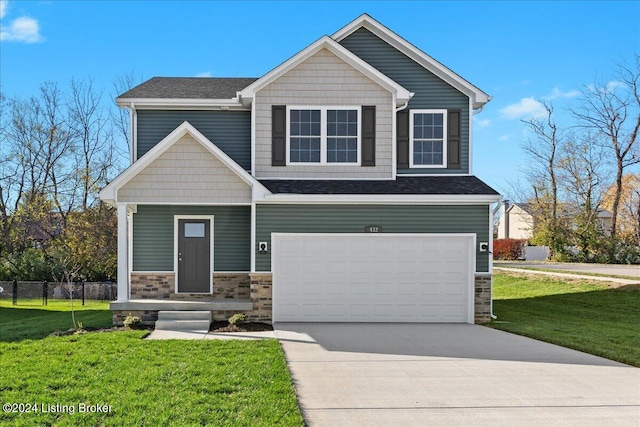 craftsman house featuring a front lawn and a garage