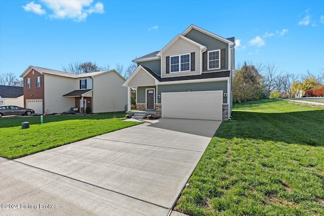 view of front of home with a garage and a front lawn