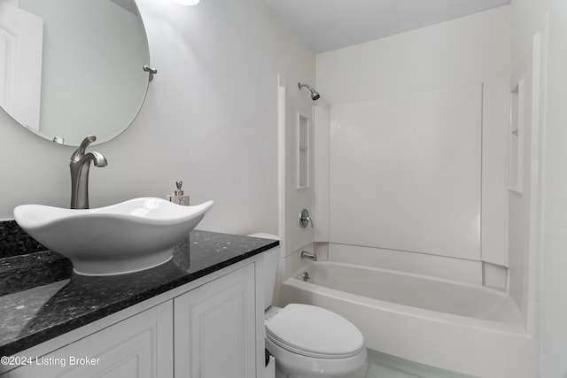 full bathroom with shower / tub combination, vanity, and toilet