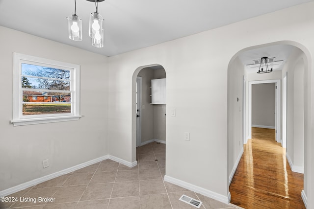 unfurnished dining area with light hardwood / wood-style floors