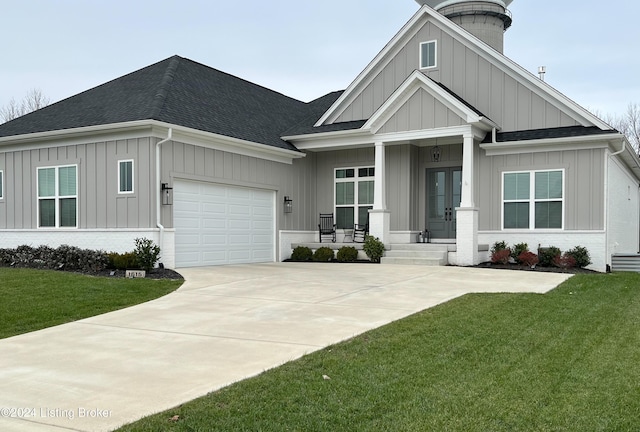 view of front facade featuring a garage and a front lawn