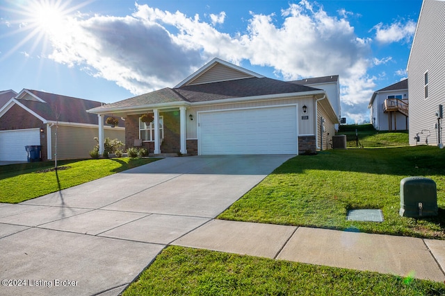 view of front of property with a garage and a front yard