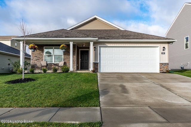 view of front of home featuring a front yard and a garage